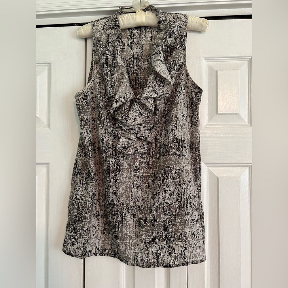 Ladies sleeveless ruffle- neck blouse